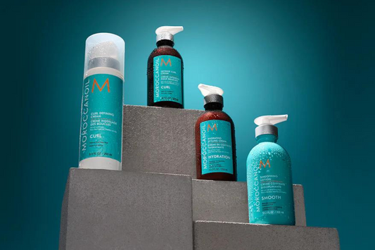 four moroccanoil styling products on a pedestal 